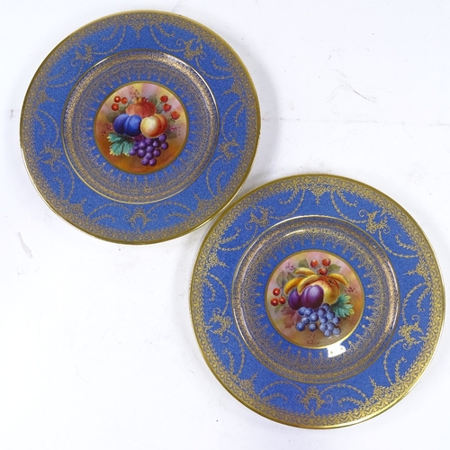 162 - George Jones Present China, a pair of blue ground gilded cabinet plates with hand painted fruit pane... 