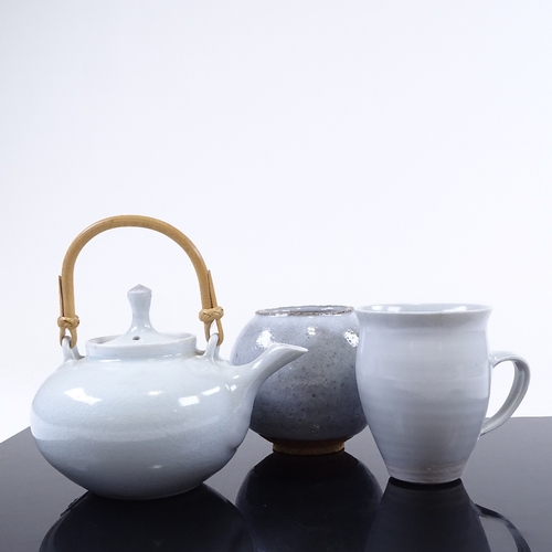 192 - A pale blue glaze Studio porcelain teapot and matching mug, by Mary Rich, and a glazed Studio potter... 