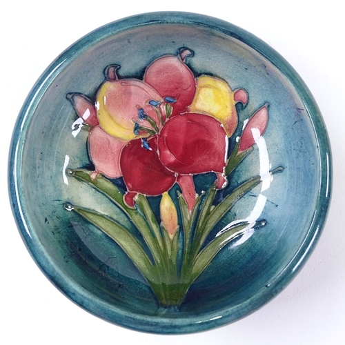 197 - A Moorcroft Pottery orchid design bowl, diameter 11cm