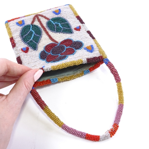 23 - A Native American beadwork pouch/bag, probably mid-20th century, with leaf and flower design and bea... 