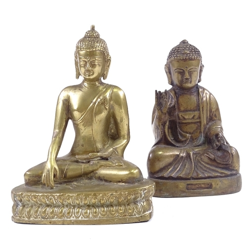 67 - 2 Oriental polished bronze seated deities, largest height 18cm (2)