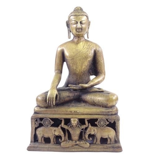 68 - An Oriental polished bronze seated Buddha, height 37cm