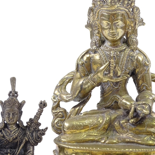 71 - An Eastern polished bronze seated deity, height 14cm, and 3 other small Oriental bronzes (4)