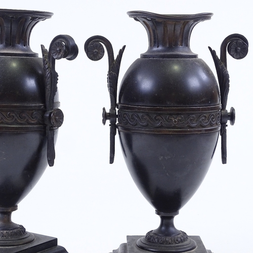 76 - A pair of Victorian bronze-mounted black marble and slate ornamental urns, height 25cm