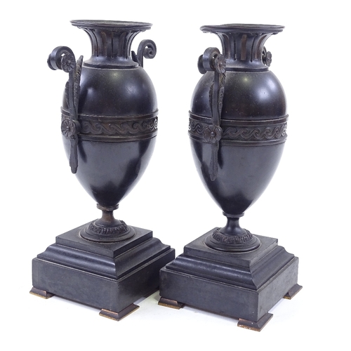 76 - A pair of Victorian bronze-mounted black marble and slate ornamental urns, height 25cm