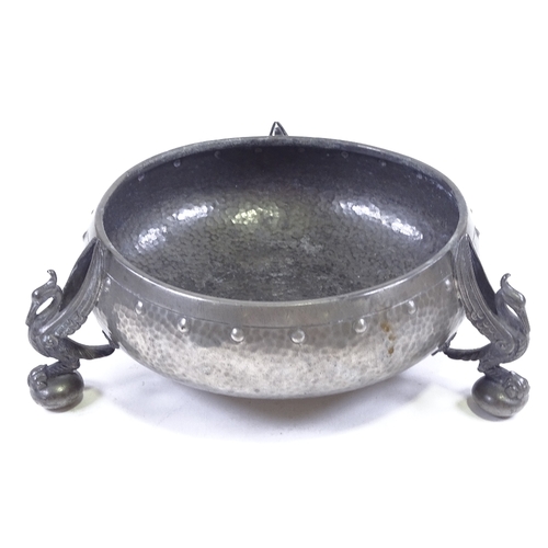 82 - An Arts and Crafts planished pewter fruit bowl, on cast phoenix design feet, stamped Homeland, seria... 