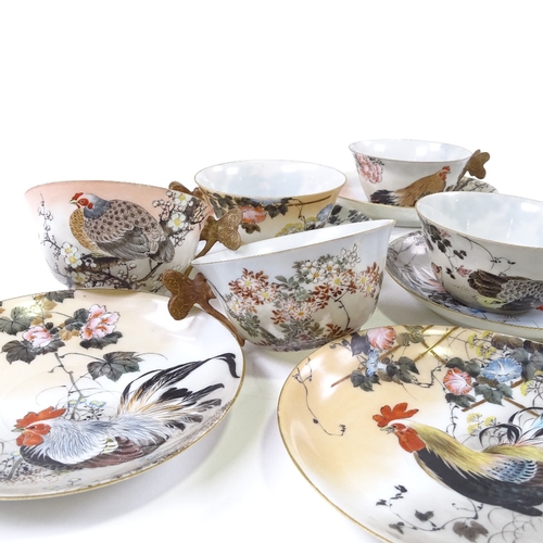 90 - A set of 5 Japanese porcelain cups and saucers, with gilded butterfly handles and painted decoration