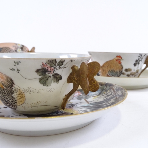 90 - A set of 5 Japanese porcelain cups and saucers, with gilded butterfly handles and painted decoration