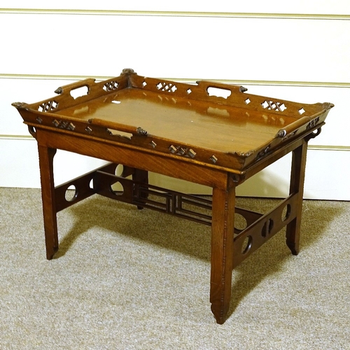 128 - A Victorian mahogany tray-top occasional table, with carved and pierced gallery, and pierced stretch... 