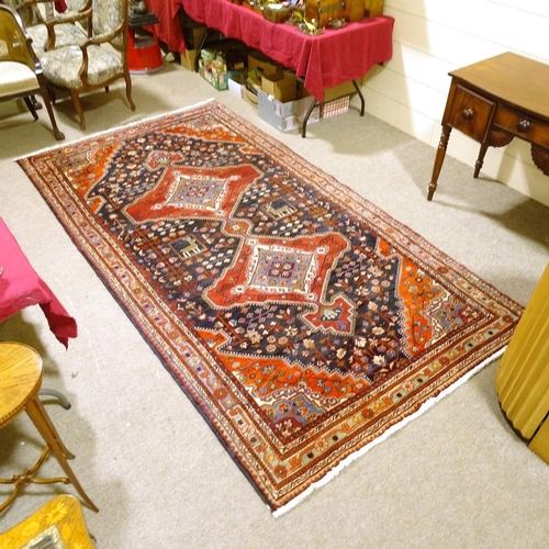 130 - A Tuyserkan handwoven floral patterned rug, 3m x 1.58m