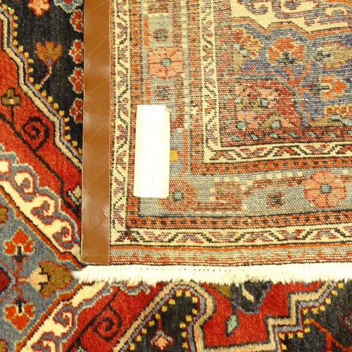 130 - A Tuyserkan handwoven floral patterned rug, 3m x 1.58m