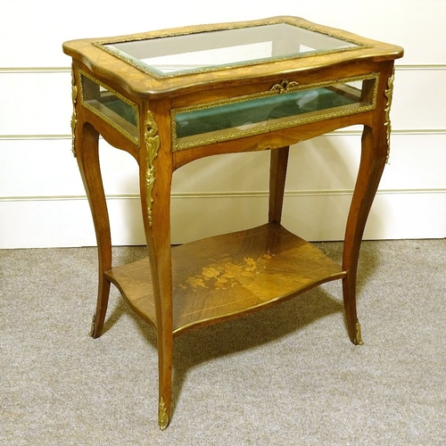 131 - A late 19th century French kingwood and marquetry inlaid display table, with gilt-bronze mouldings a... 