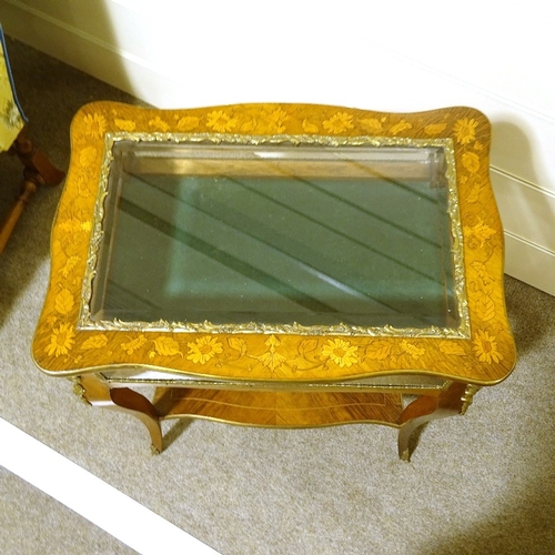 131 - A late 19th century French kingwood and marquetry inlaid display table, with gilt-bronze mouldings a... 