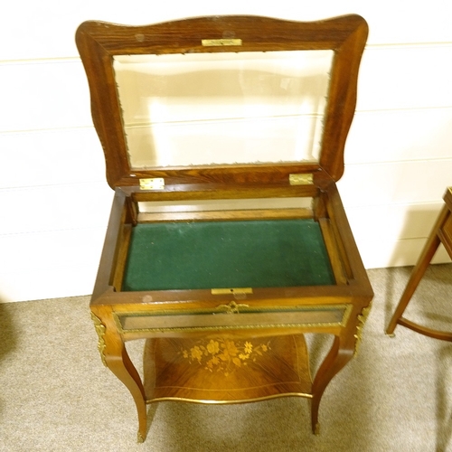 131 - A late 19th century French kingwood and marquetry inlaid display table, with gilt-bronze mouldings a... 