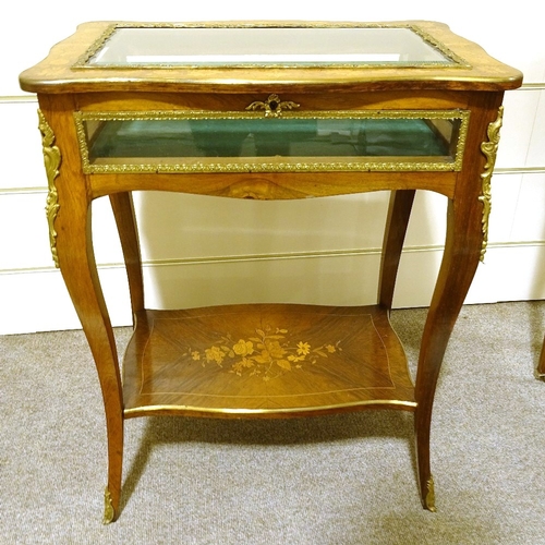 131 - A late 19th century French kingwood and marquetry inlaid display table, with gilt-bronze mouldings a... 