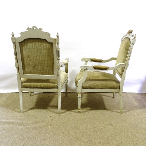 204 - A pair of French carved painted and gilded wood-framed open arm salon chairs