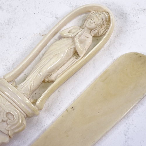 155 - A Chinese ivory paper knife with relief carved handle in the form of a deity, length 30cm, and a pla... 