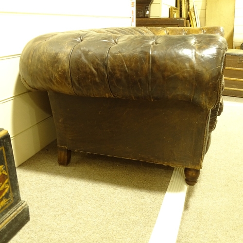 209 - A brown buttoned leather-upholstered 3-seater Club Chesterfield sofa, early 20th century, overall le... 