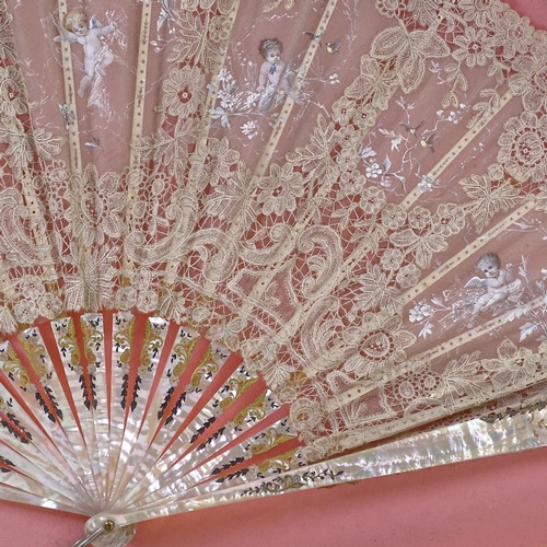 210 - A hand painted lace fan, with carved mother of pearl and ivory sticks, in frame, frame width 76cm.