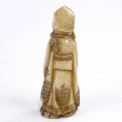 214 - A carved ivory okimono, Sage figure with hare, height 11cm.