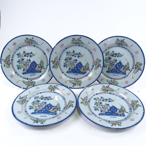 224 - A set of 5 19th century Continental faience pottery plates with hand painted decoration, diameter 23... 