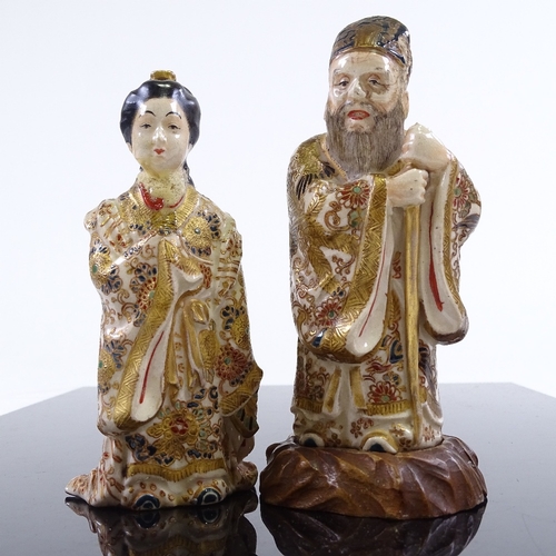 229 - A pair of Japanese Meiji Period gilded porcelain standing figures, one on hardwood stand, height 13c... 