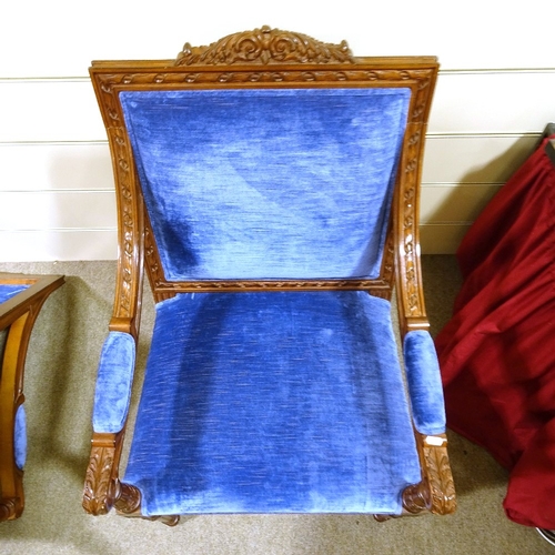 235 - A pair of Continental carved and stained wood framed open-arm chairs, with blue velvet upholstery