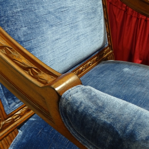 235 - A pair of Continental carved and stained wood framed open-arm chairs, with blue velvet upholstery