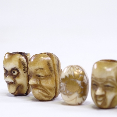 245 - A group of 5 Japanese staghorn ojime beads, circa 1900, depicting grotesque faces, length 18mm, and ... 