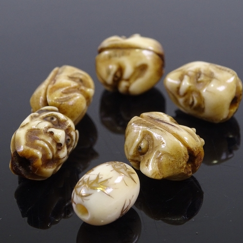 245 - A group of 5 Japanese staghorn ojime beads, circa 1900, depicting grotesque faces, length 18mm, and ... 