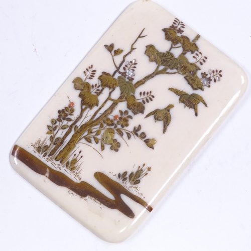 246 - A Japanese ivory and Shibayama plaque, Meiji Period, with inlaid mother-of-pearl flowerheads, 7.5cm ... 