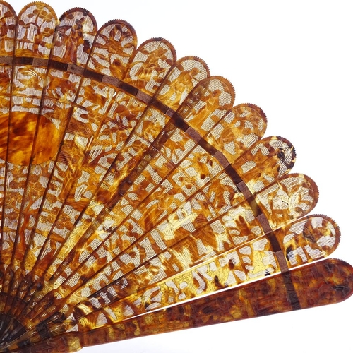 250 - An early 19th century Chinese tortoiseshell brise fan, with relief carved guards and finely carved a... 