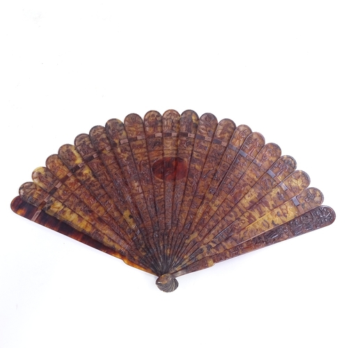 250 - An early 19th century Chinese tortoiseshell brise fan, with relief carved guards and finely carved a... 