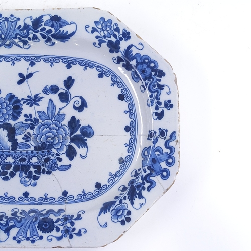 270 - An 18th century Delft blue and white pottery meat plate, hand painted floral decoration, 42cm x 31cm