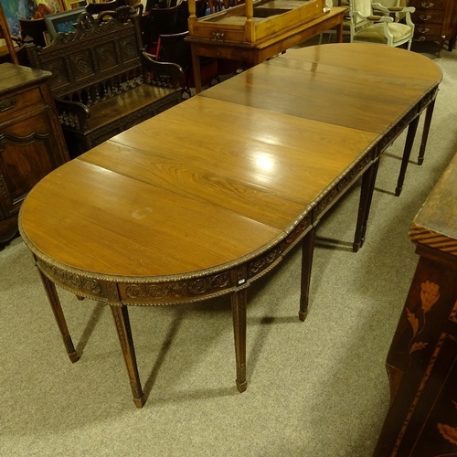 280 - A large 19th century Anglo-Indian padouk wood 4-section D-end dining table, with leaf carved edge an... 