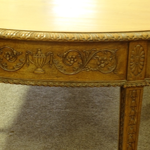 280 - A large 19th century Anglo-Indian padouk wood 4-section D-end dining table, with leaf carved edge an... 