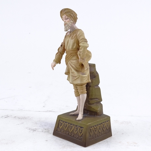 289 - An Austrian porcelain figure of an Indian man wearing a turban, maker's marks EW Vienna, height 19cm