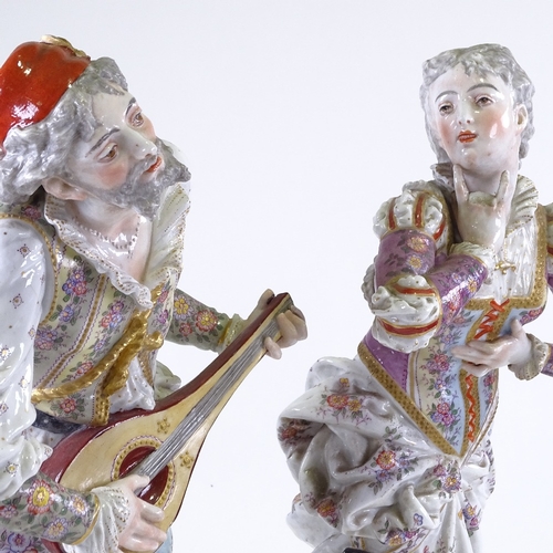 291 - A pair of 19th century Continental porcelain figures, minstrel and lady, transfer anchor marks under... 