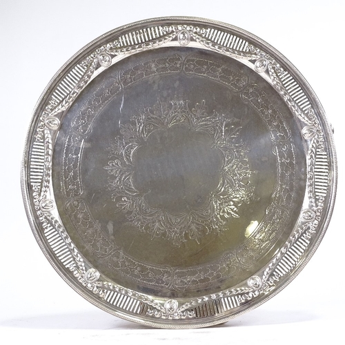 292 - A large circular electroplate tray, with pierced and embossed surround, diameter 53cm