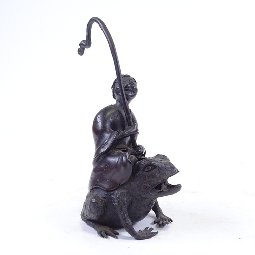 303 - A Chinese patinated bronze sculpture of a man riding a toad, height to man's head 16cm