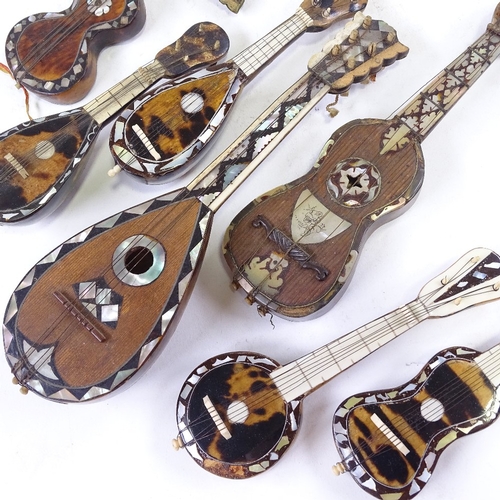 304 - 7 Italian tortoishell and mother of pearl minature instruments, largest length 21cm.