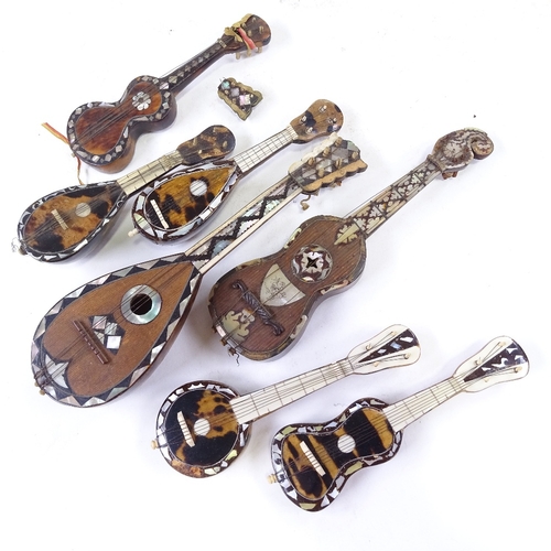 304 - 7 Italian tortoishell and mother of pearl minature instruments, largest length 21cm.