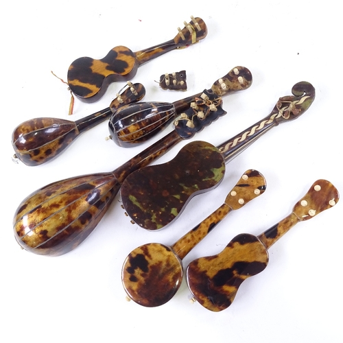 304 - 7 Italian tortoishell and mother of pearl minature instruments, largest length 21cm.