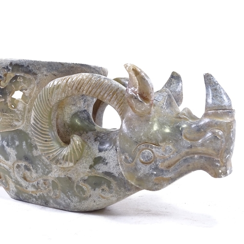 305 - A Chinese green stone carved mythical figure with carved and pierced bowl in back