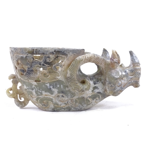 305 - A Chinese green stone carved mythical figure with carved and pierced bowl in back