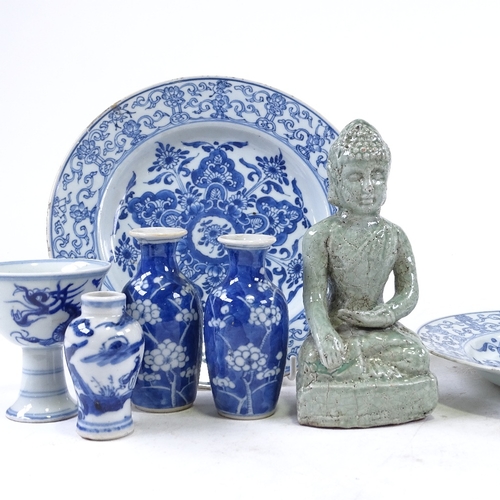 311 - A group of Oriental porcelain, including a seated Buddha, height 16cm