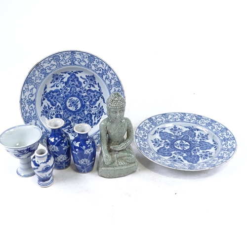 311 - A group of Oriental porcelain, including a seated Buddha, height 16cm