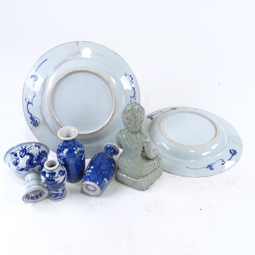 311 - A group of Oriental porcelain, including a seated Buddha, height 16cm