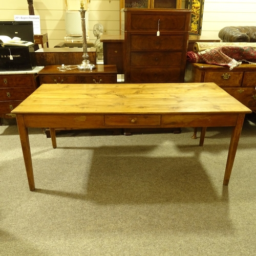 313 - A 19th century French fruitwood farmhouse dining table with plank top, single side frieze drawer and... 