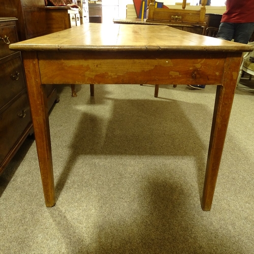 313 - A 19th century French fruitwood farmhouse dining table with plank top, single side frieze drawer and... 